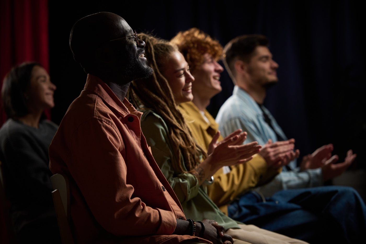 Diverse audience celebrating together (editorial placeholder image)