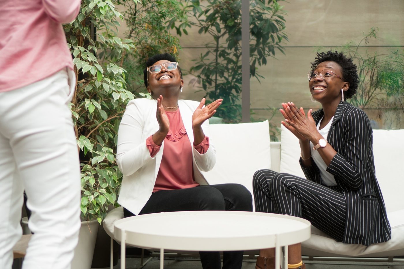 Women sharing an uplifting moment in community (editorial placeholder image)